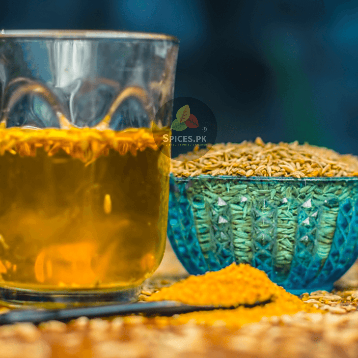 Pure organic zeera powder with a glass of healthy cumin drink (zeera ka pani) and whole white cumin seeds by Spices.pk in Pakistan.