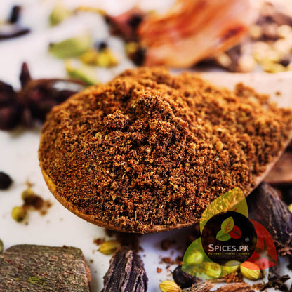 Macro close-up of Spices.pk Garam Masala Powder, showcasing the fine, rich texture of freshly ground aromatic spices. High-quality seasoning for authentic meat, vegetable, and rice dishes.