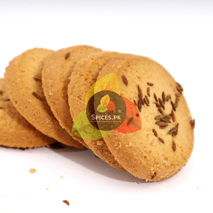 Freshly baked Cumin biscuits (Zeera cookies) garnished with whole Sufaid Zeera seeds for a savory flavor.