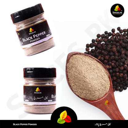 Black pepper powder in a jar with a spoonful of powder and black peppercorns on a white background. Comparison of Spices.pk whole black peppercorns and fine Kali Mirch powder in a wooden spoon.