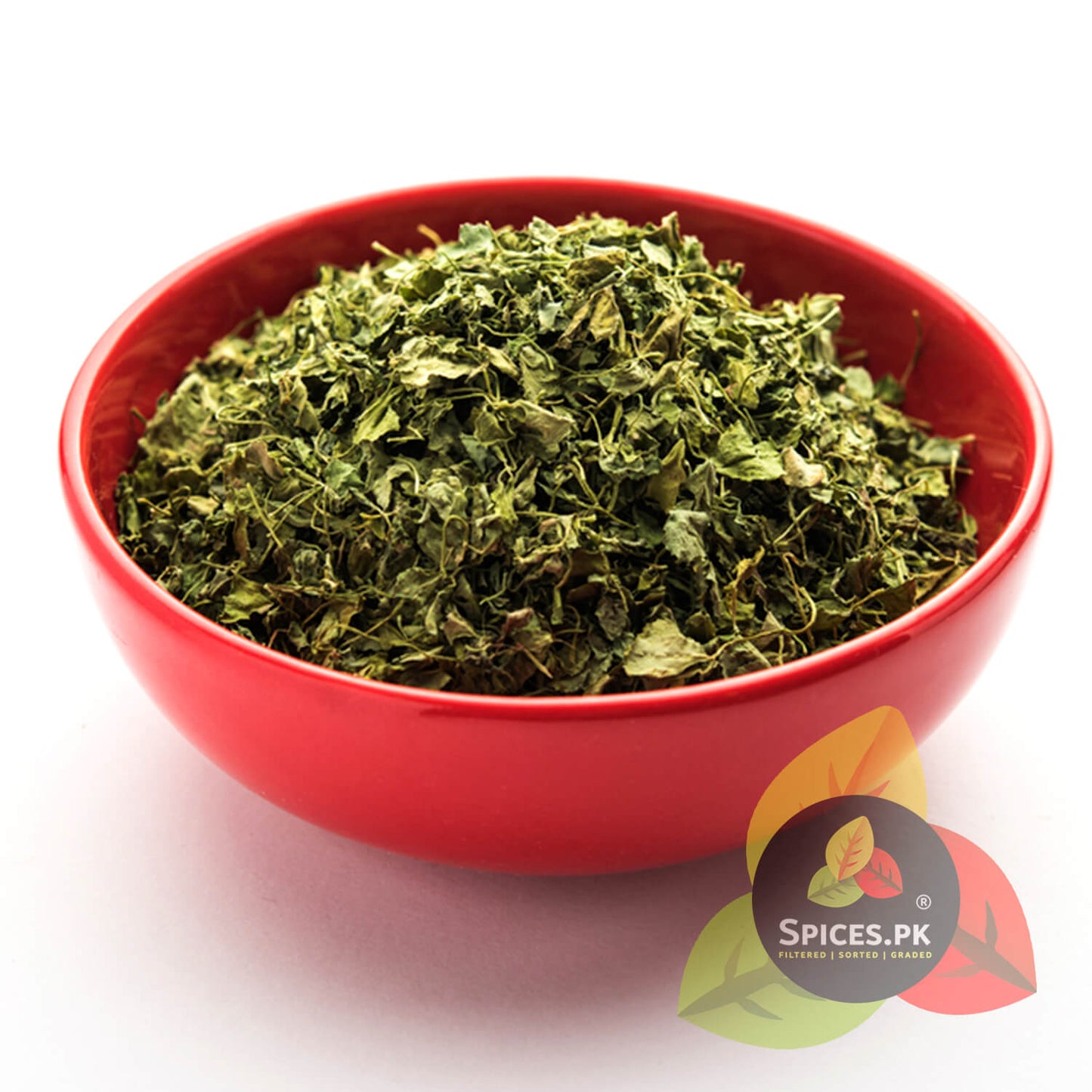 Red bowl filled with green leafy herbs on a white background, branded with 'Spices.PK'.A red bowl filled with dried fenugreek leaves (Qasoori Methi) showcasing a natural green color and flaky texture free from preservatives.