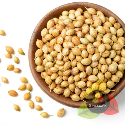 Wooden bowl filled with coriander seeds on a white background, branded 'Spices.PK'.Top-down view of premium organic whole coriander seeds (Sabut Dhania) in a rustic wooden bowl, showcasing high-grade natural spices.