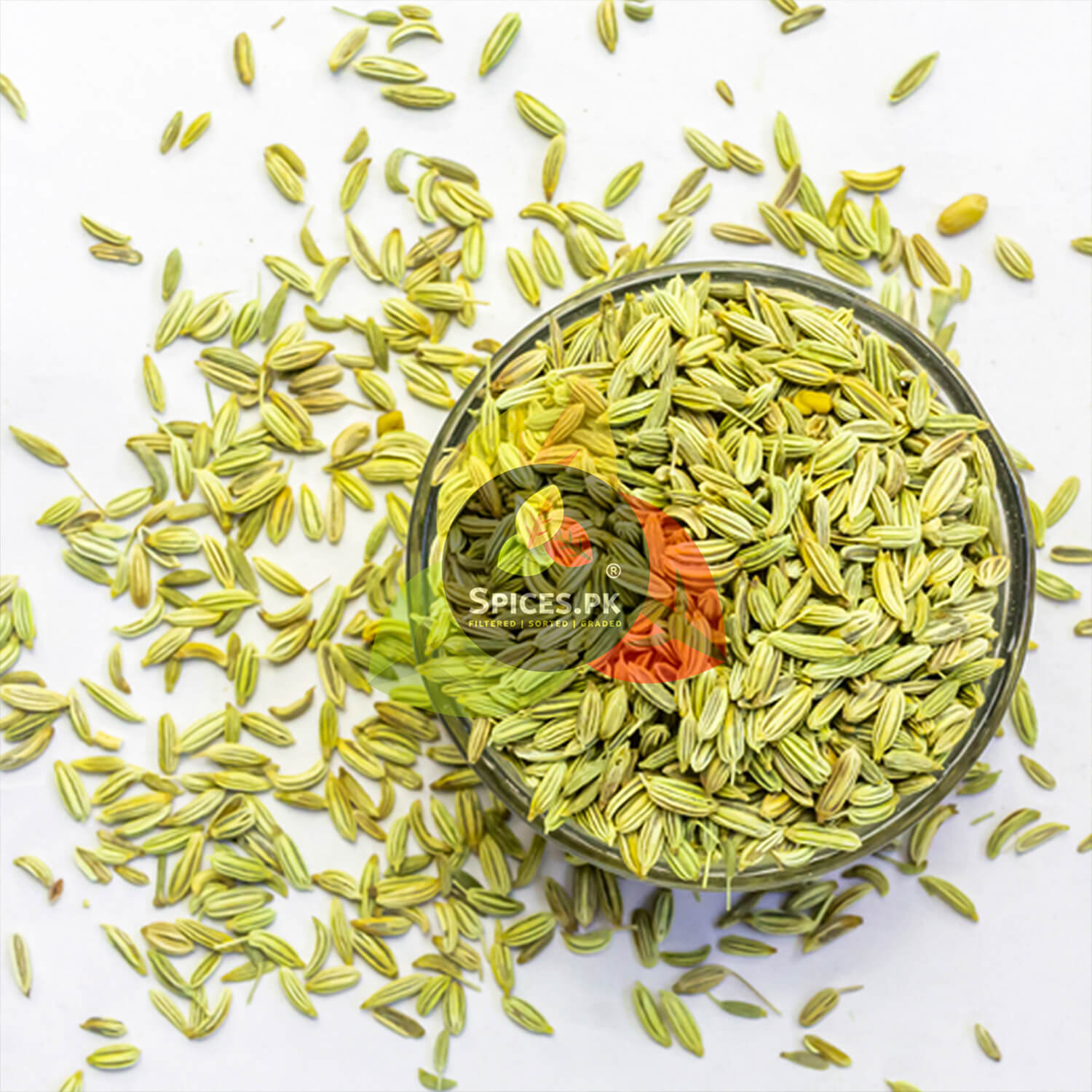 High-quality, clean green fennel seeds in a glass bowl, showcasing the sorted and graded texture of top-ranked saunf in Pakistan.