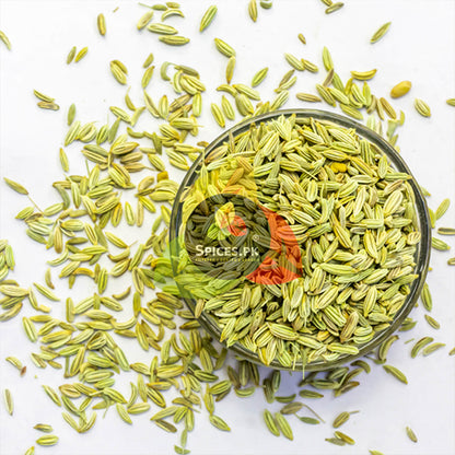 High-quality, clean green fennel seeds in a glass bowl, showcasing the sorted and graded texture of top-ranked saunf in Pakistan.