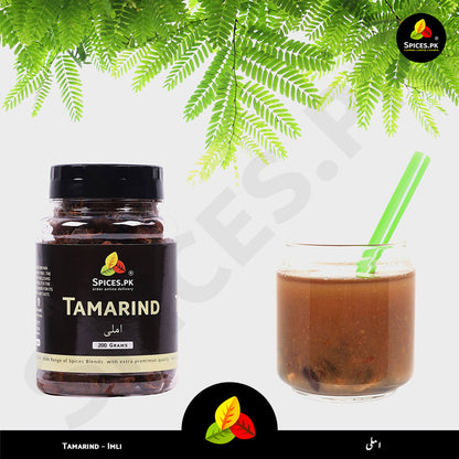 Tamarind jar and a glass of tamarind drink with green leaves in the background.Spices.pk quality guarantee: Pure Tamarind (Imli) with no artificial additives, foil-sealed to preserve the natural tangy flavor and freshness.