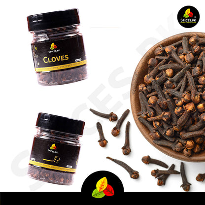 A high-quality heap of clean, full-headed whole cloves next to an airtight Spices.pk jar with a quality check checklist.