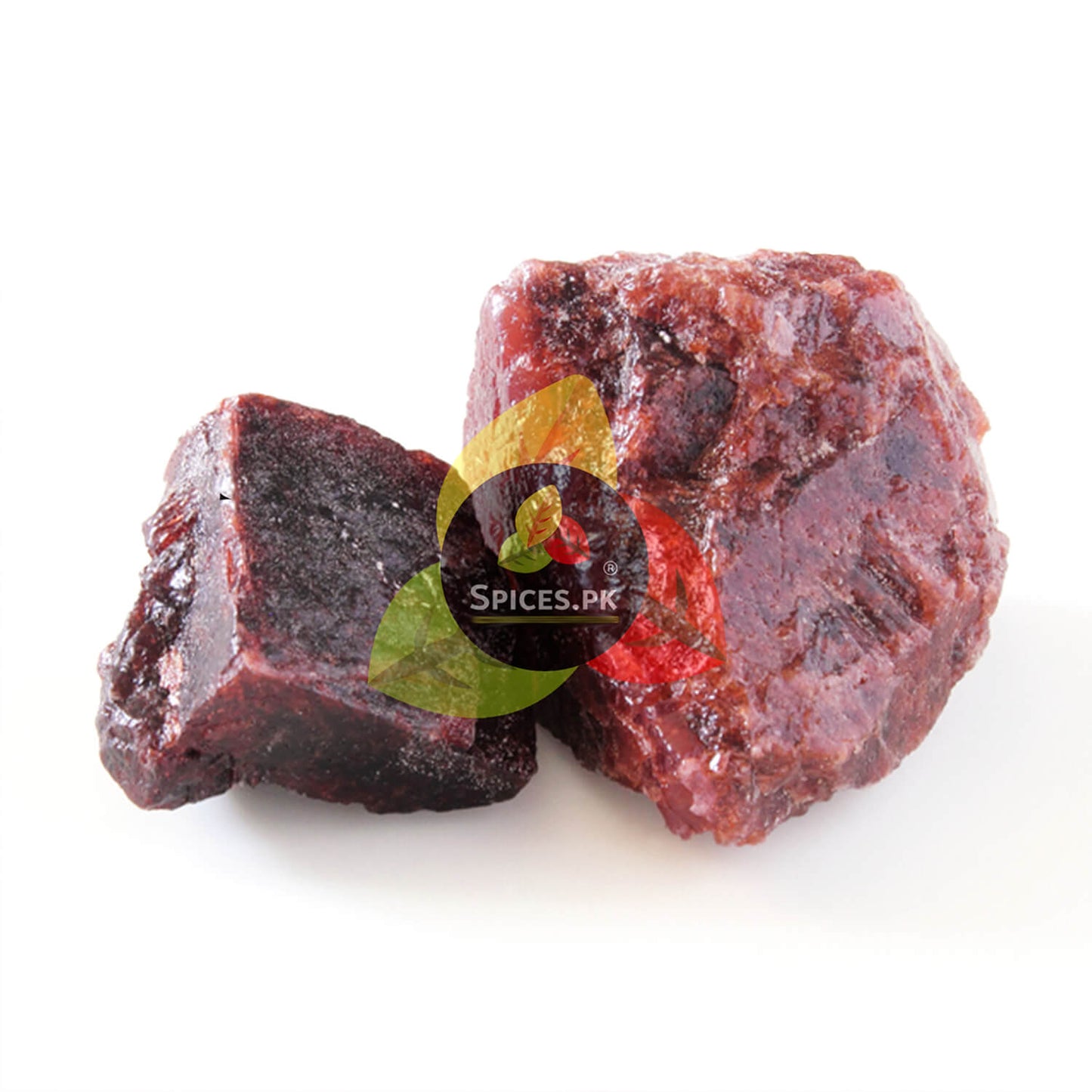 Two pieces of red chilies on a white background with 'Spices.PK' logo.Raw mineral chunks of natural Black Salt (Kala Namak) sourced by Spices.pk.