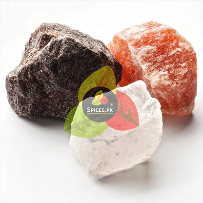 Three different types of spices on a white background with 'Spices.PK' .logo.Raw Himalayan rock salt chunks (black, pink, white) - Natural salt minerals by Spices.pk.
