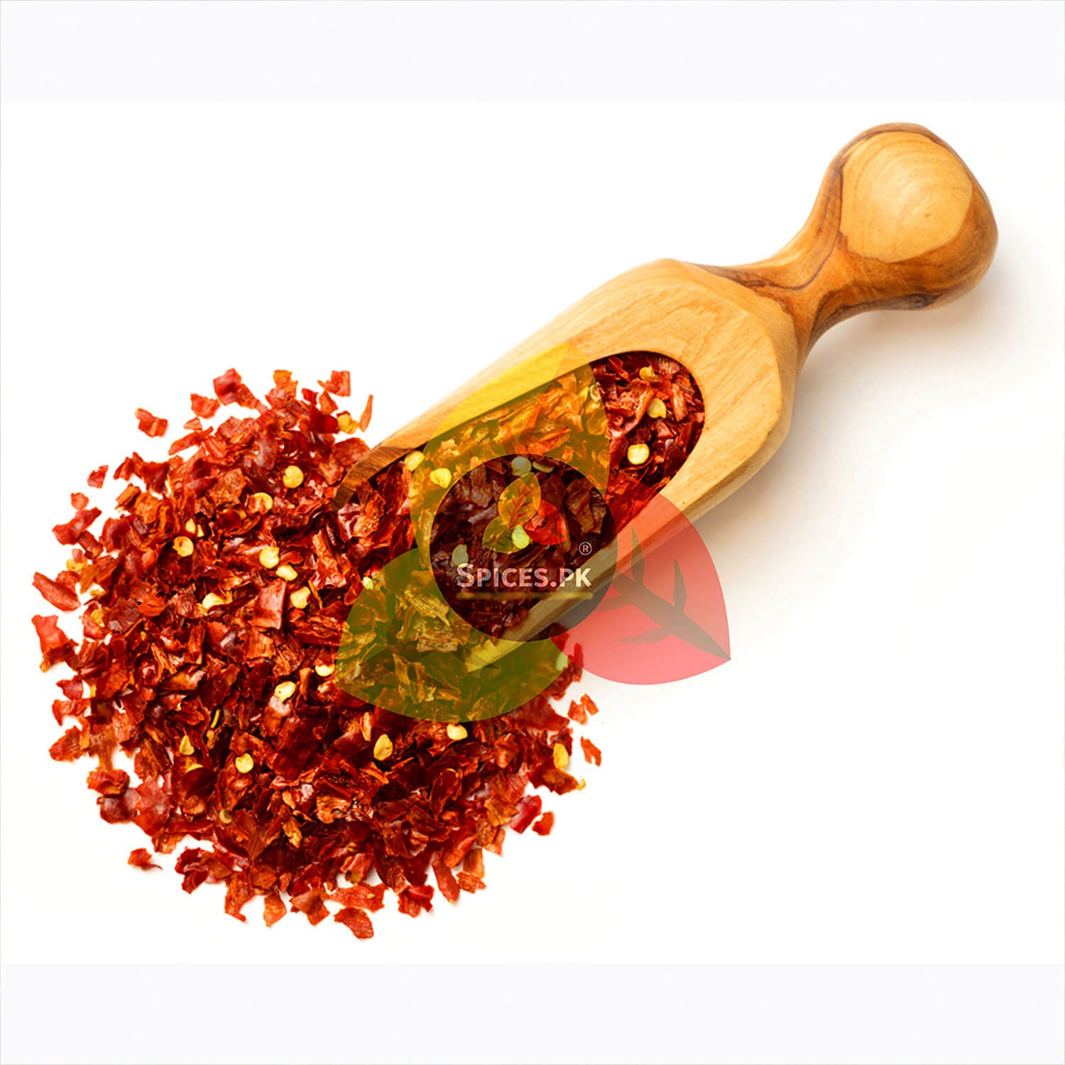 Close-up of pure crushed Red Chilli Flakes in a wooden scoop on a white background – Premium Dara Lal Mirch by Spices.pk.