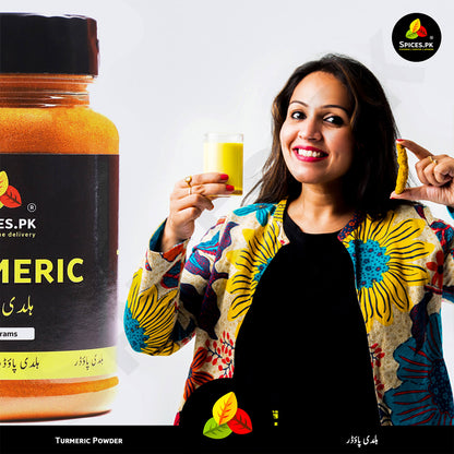 Woman holding a glass of Turmeric Milk (Haldi Doodh) and raw root – Use Spices.pk pure haldi for immunity.